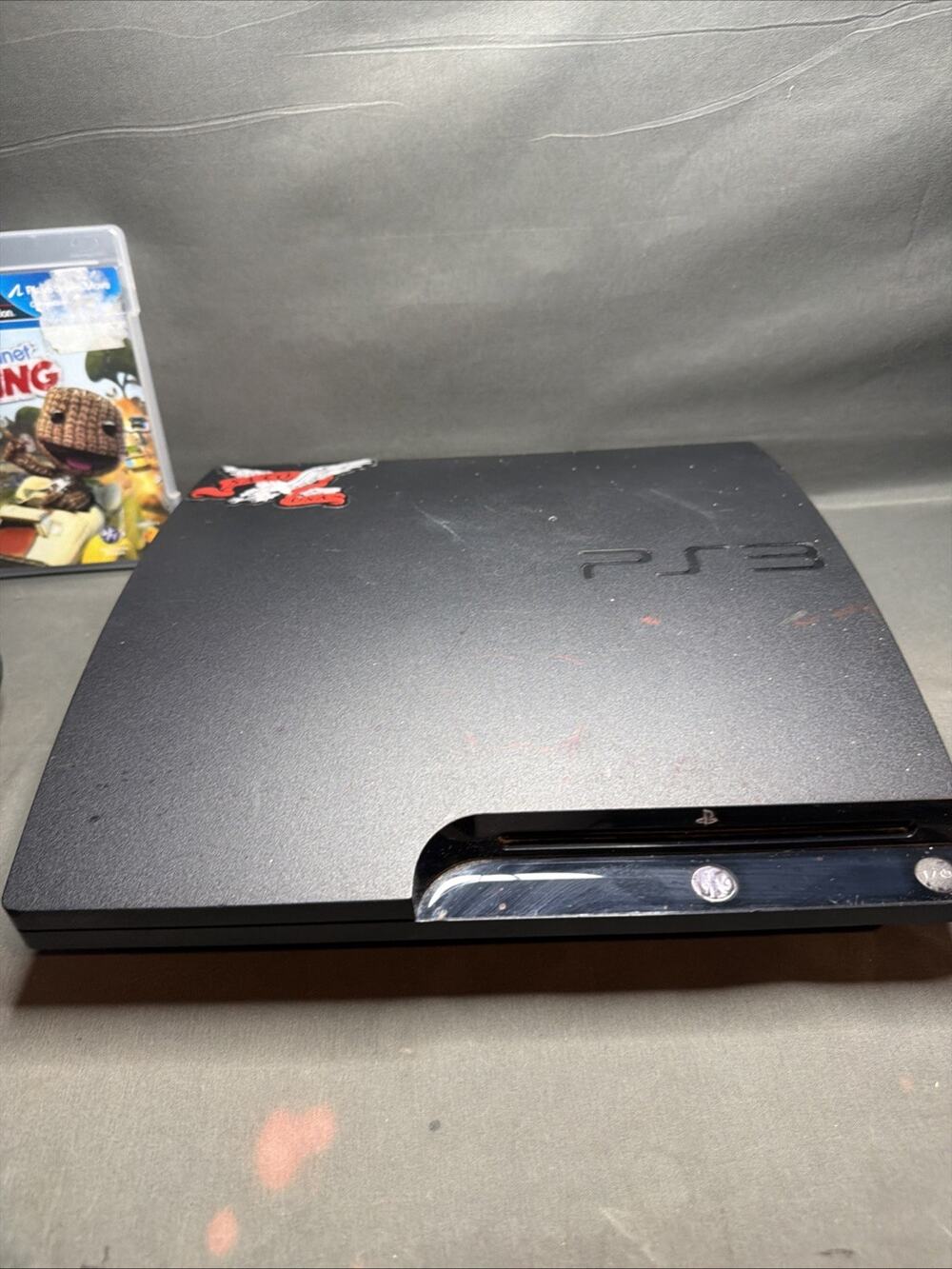 PS3 Slim Console CECH-3001A 160GB 2 Games Secret Code Book, Controller & Cords